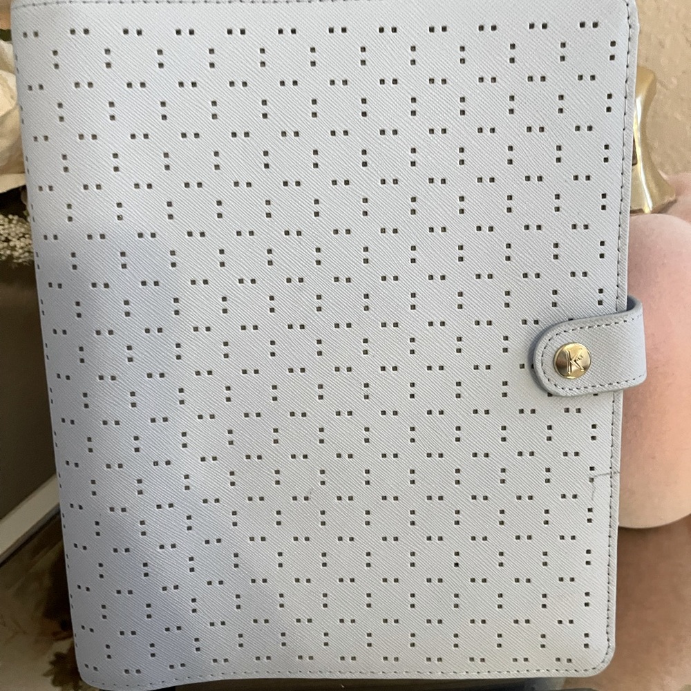 It’s a light blue Kiki.k planner. Slightly used with blank pages.